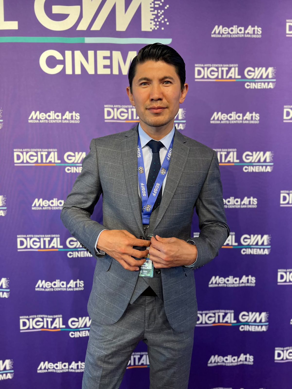 Medet Aman on the step-and-repeat at Digital Gym Cinema in San Diego